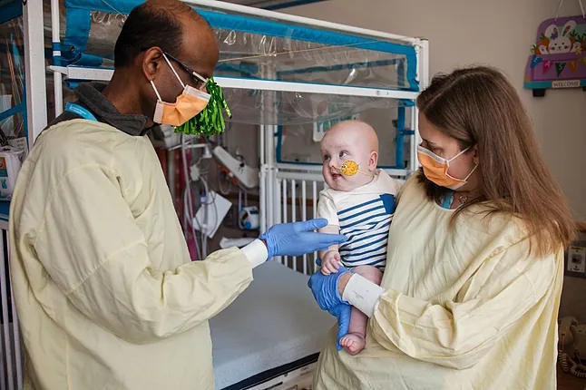 Kiran Musunuru and Rebecca Ahrens-Nicklas with little KJ.
