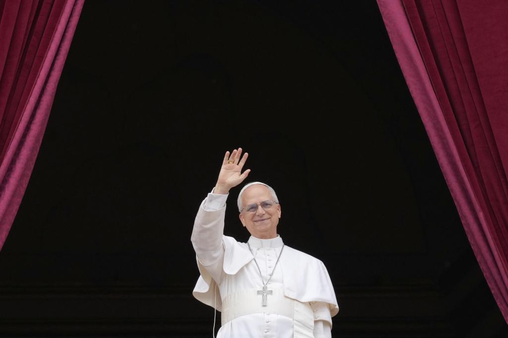 Pope Leo XIV appears on the central balcony of St. Peter's Basilica