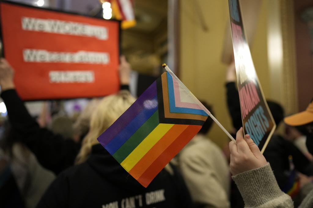 Protesters fill the Iowa state Capitol to denounce a bill that would strip the state civil rights code of protections based on gender identity