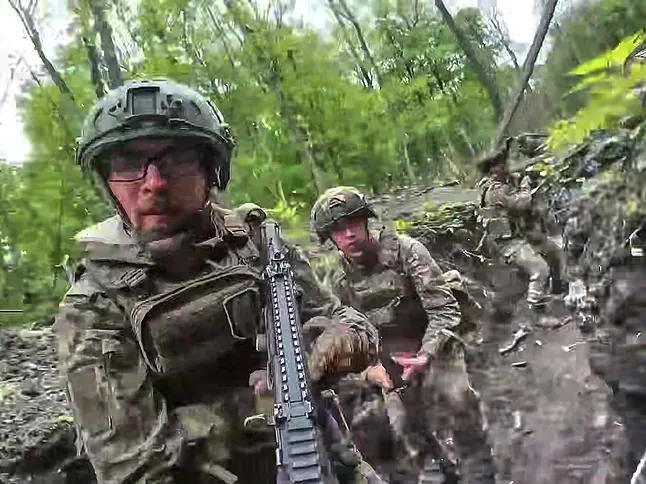 Russian soldiers in a trench on the Ukrainian front.