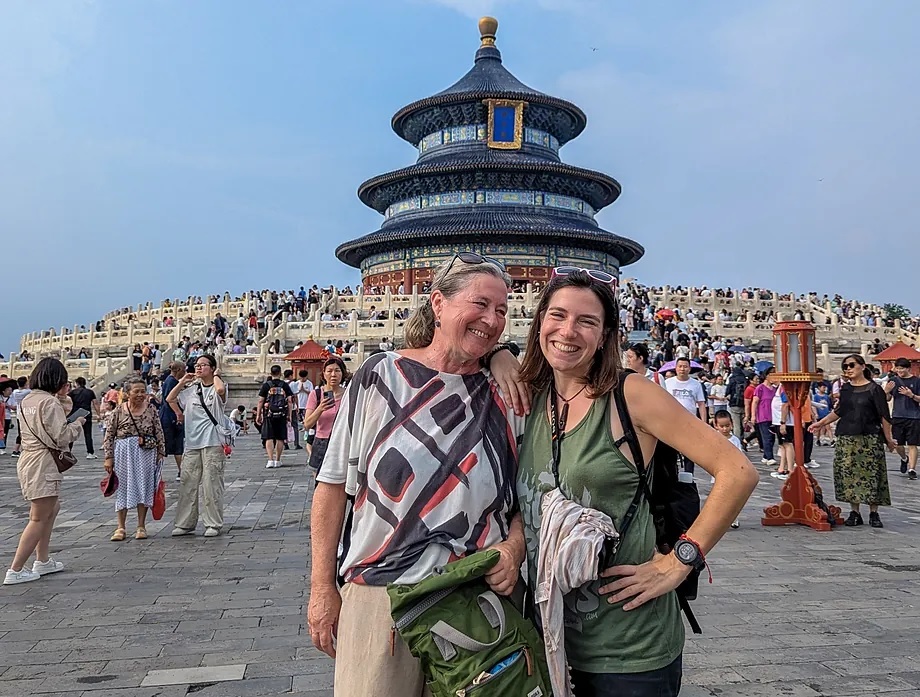 The young woman, with her mother, who came to visit her in Asia.
