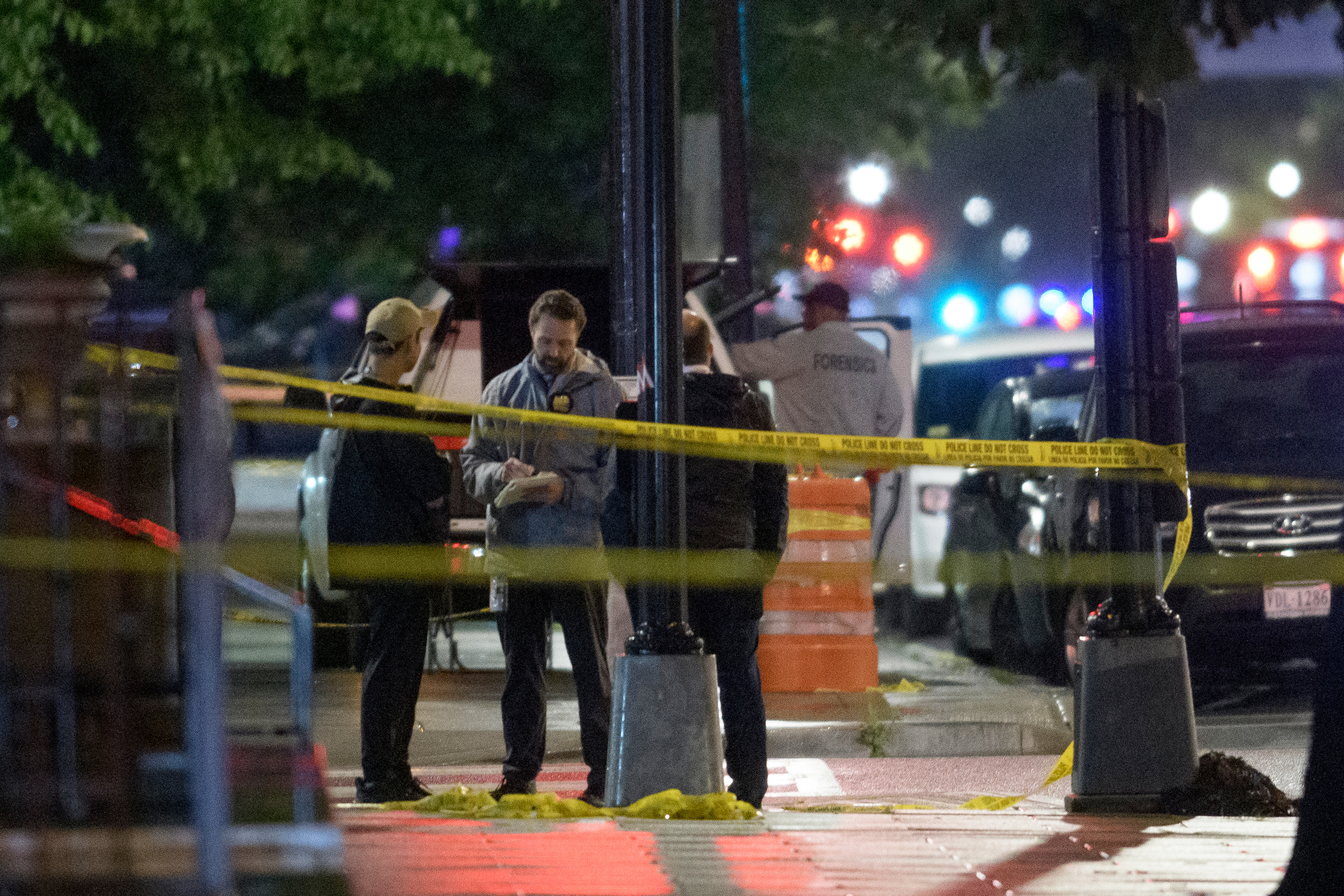 Law enforcement work the scene after two staff members of the Israeli Embassy in Washington were shot and killed outside the Capital Jewish Museum