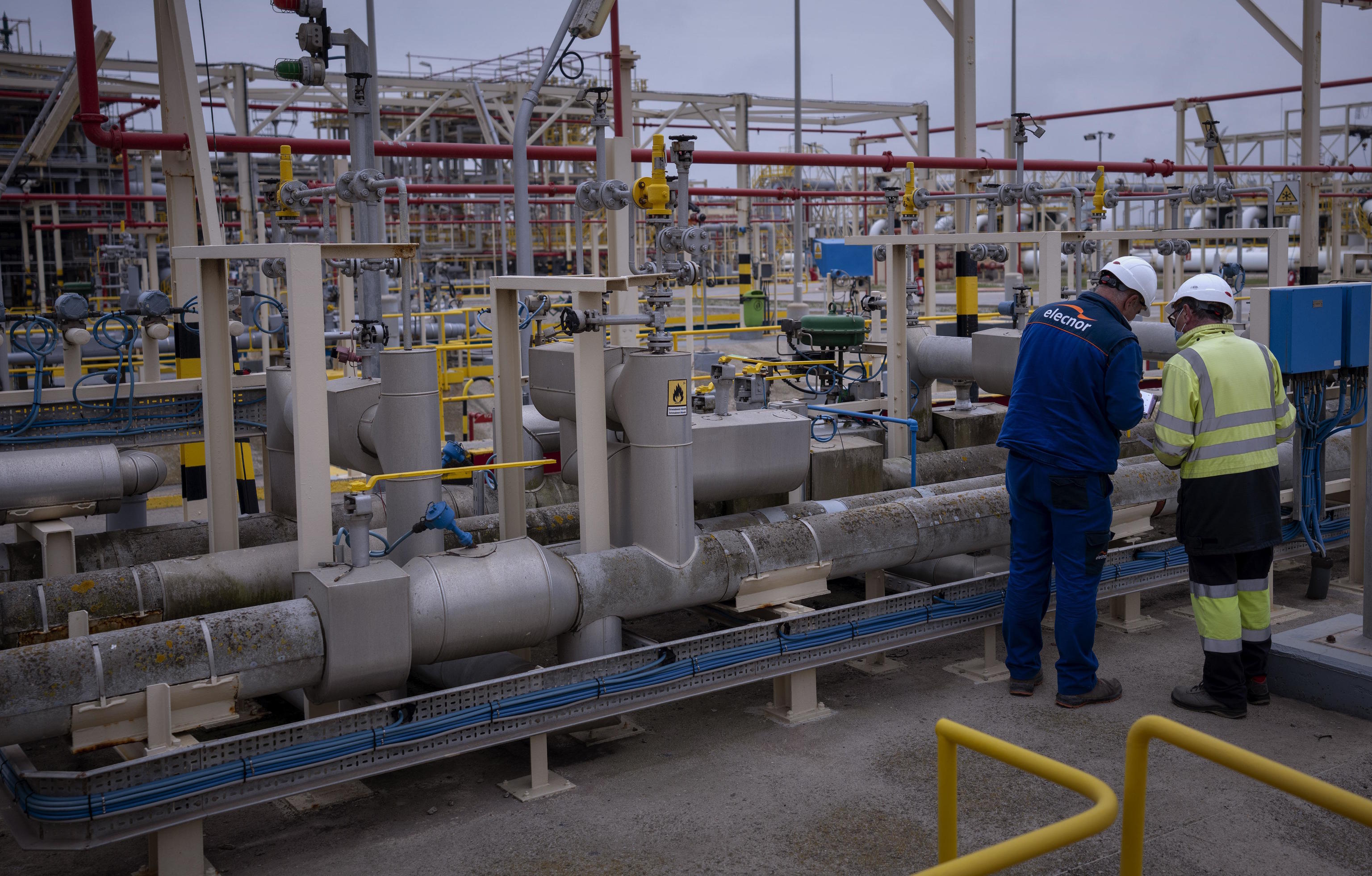 Operators work at Enagas regasification plant, the largest LNG plant in Europe, in Barcelona.