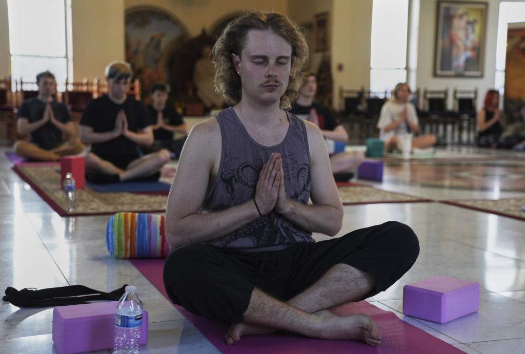 avin Bartholomew attends a 90-minute yoga class at Shri Shri Radha Krishna Temple in Spanish Fork, Utah