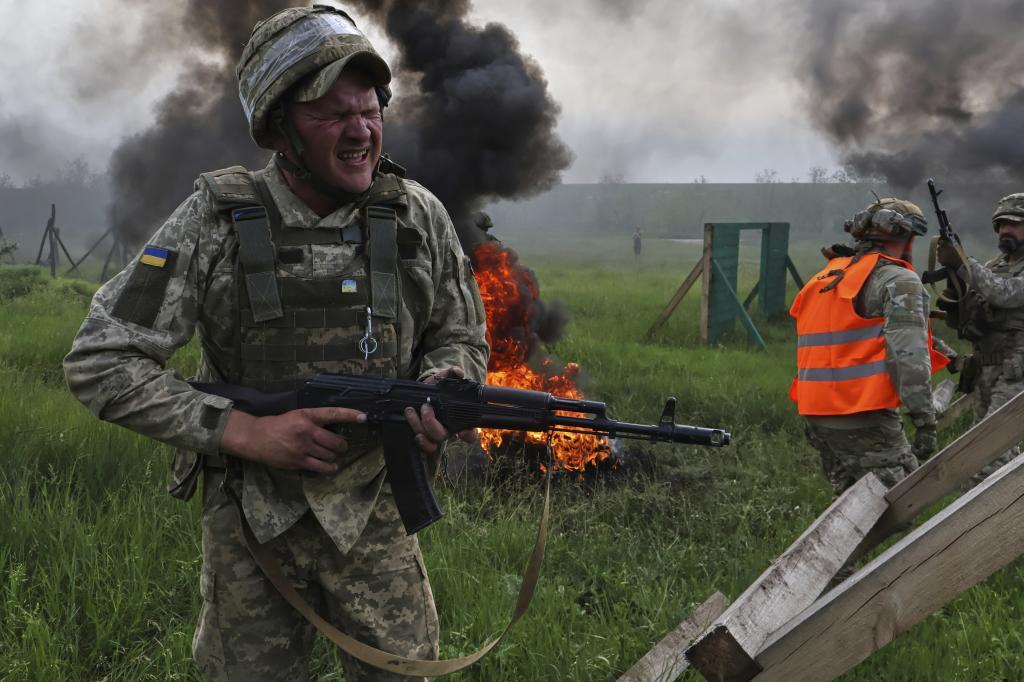 Ukrainian servicemen attend a military training in Zaporizhzhia region