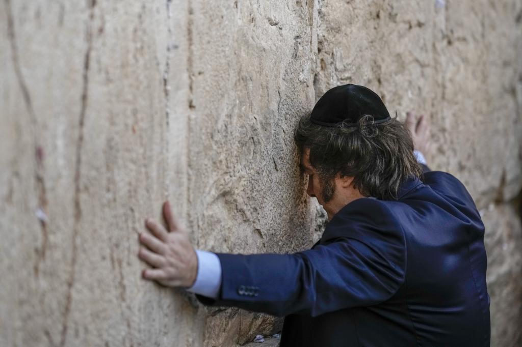 Argentine President Javier Milei touches the Western Wall