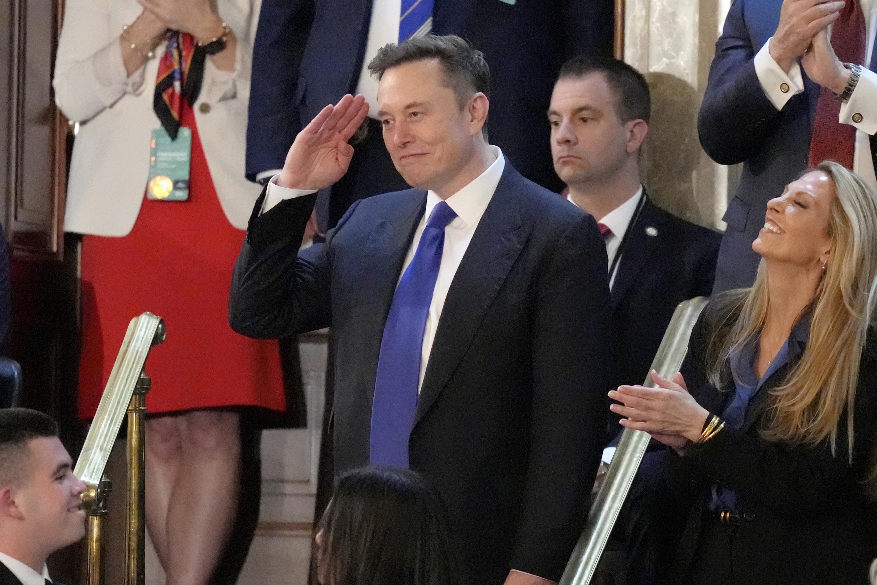 Elon Musk gestures.