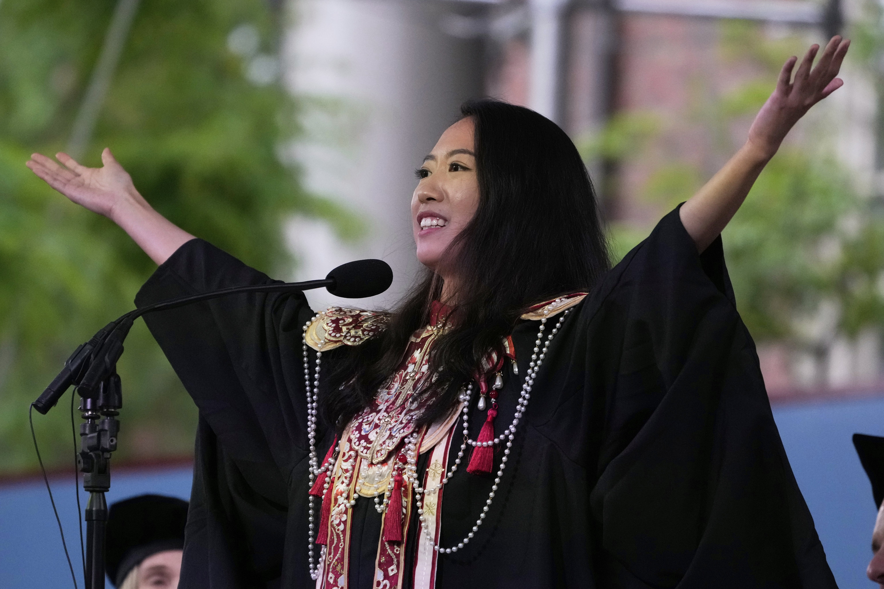 Yurong "Luanna" Jiang addresses classmates during commencement ceremonies at Harvard University.