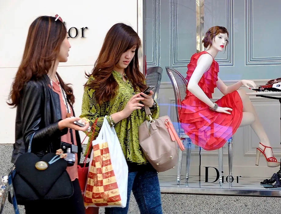 Asian clients on Serrano and Ortega y Gasset streets in Madrid.