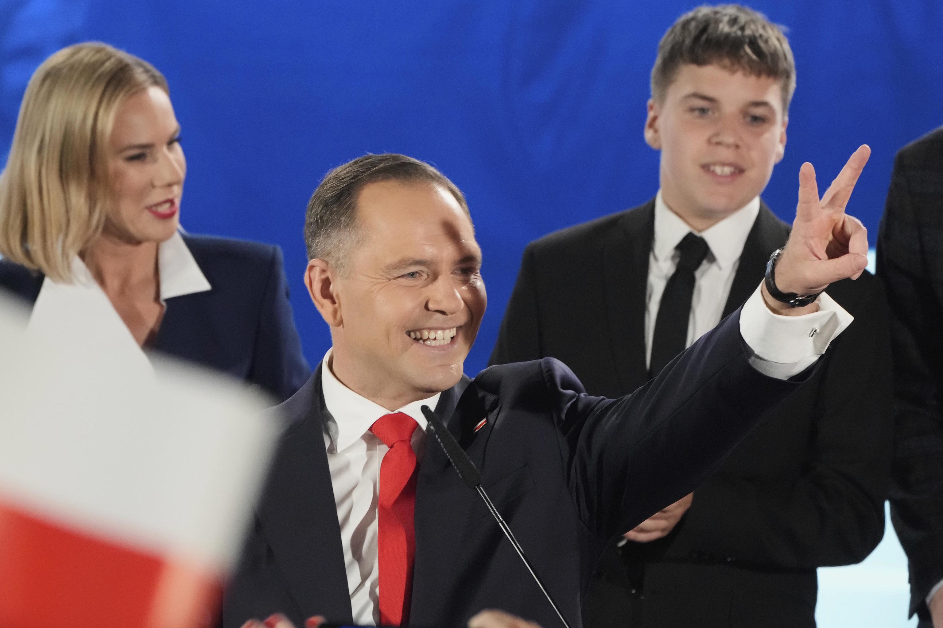 Presidential candidate Karol Nawrocki greets supporters.