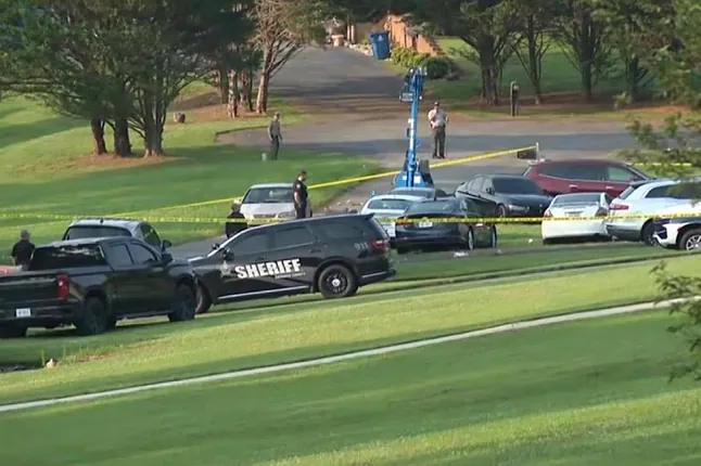 Police officers cordon off the crime scene.