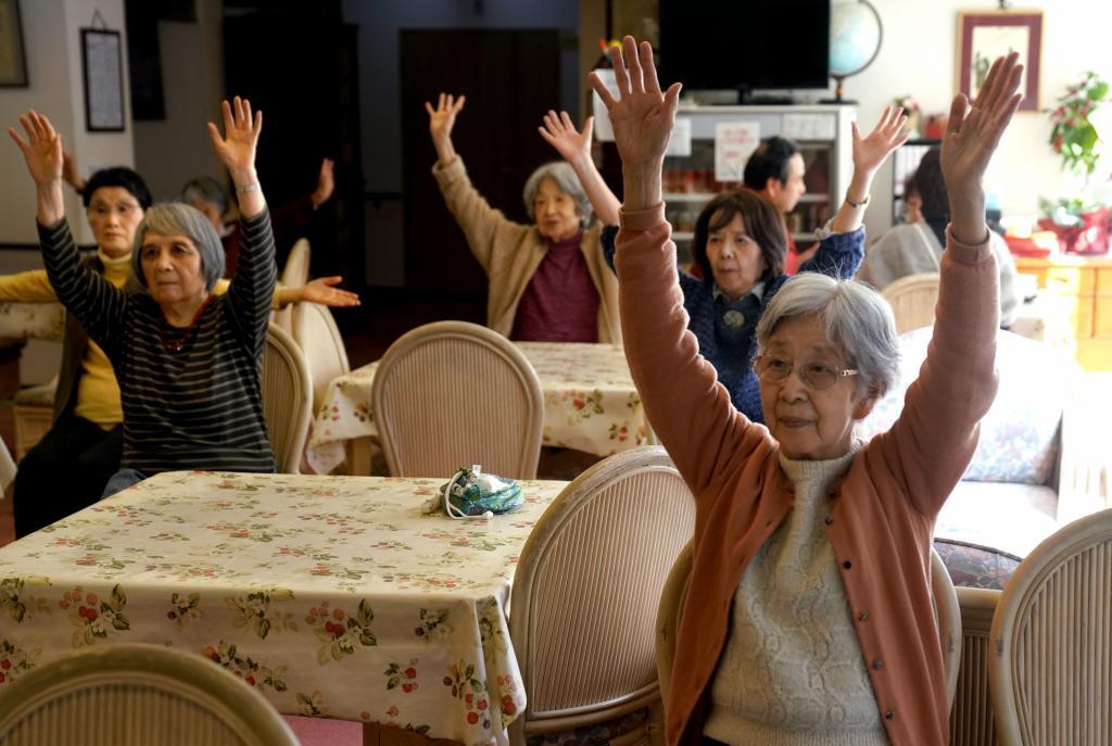 Aged people do exercises at Silver Villa Koyama, a home for the aged, in Tokyo
