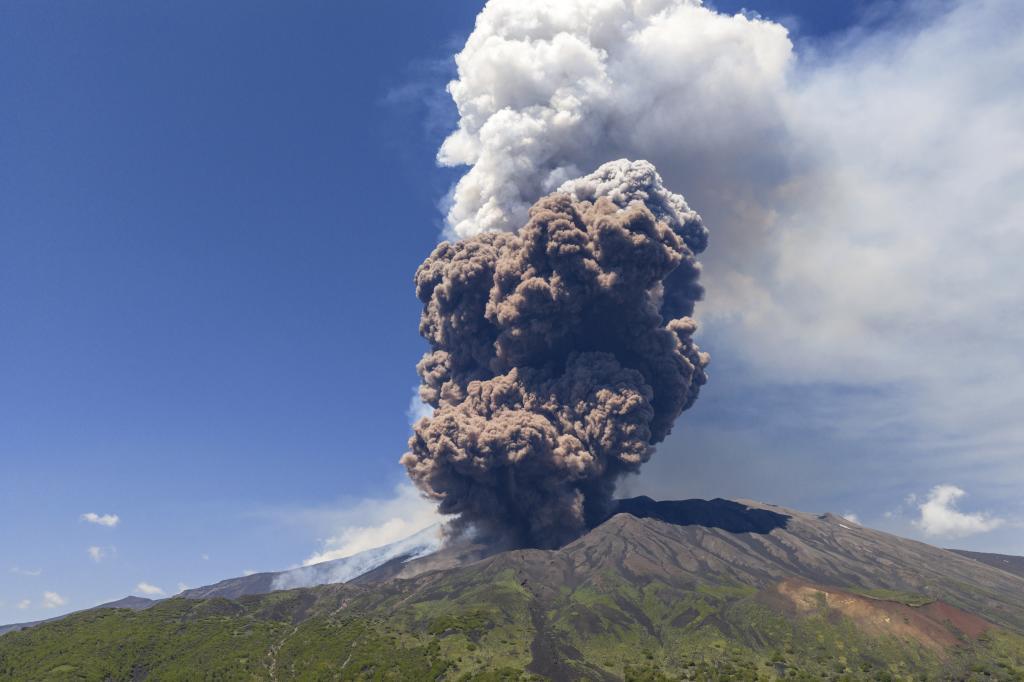 Smoke billows from Mount Etna volcano.