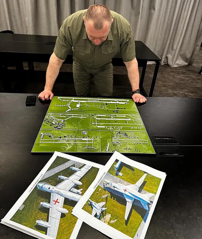 The head of the Ukrainian Security Service studies the location of Russian aviation in his office.