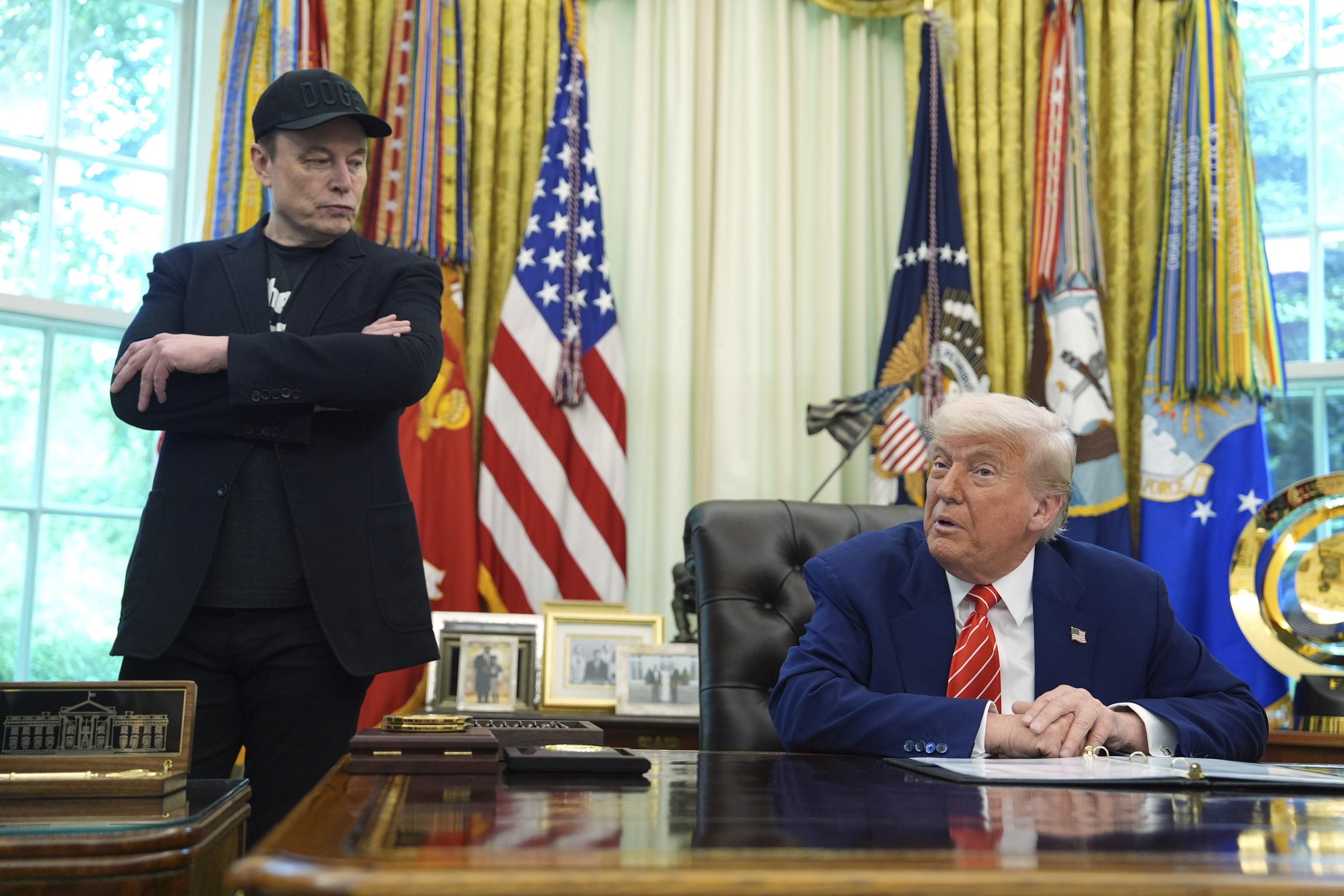 Tesla and SpaceX CEO Elon Musk, left, and US President Donald Trump.