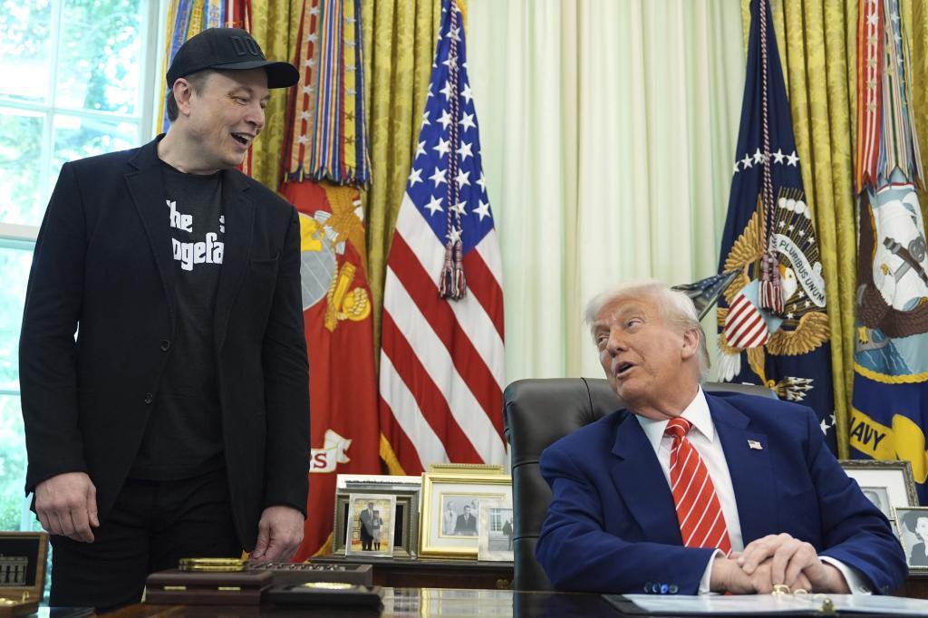 Tesla and SpaceX CEO Elon Musk, left, and President Donald Trump