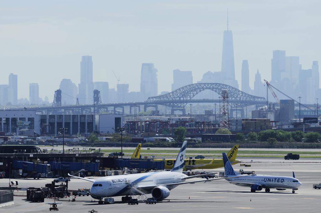 The New York City skyline is seen behind Newark Liberty International Airport in Newark