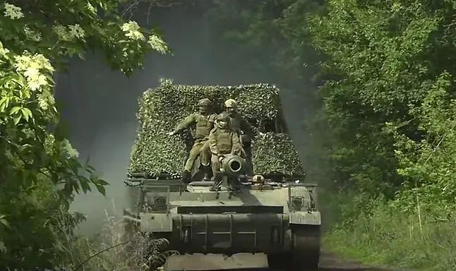 Russian soldiers in a tank.
