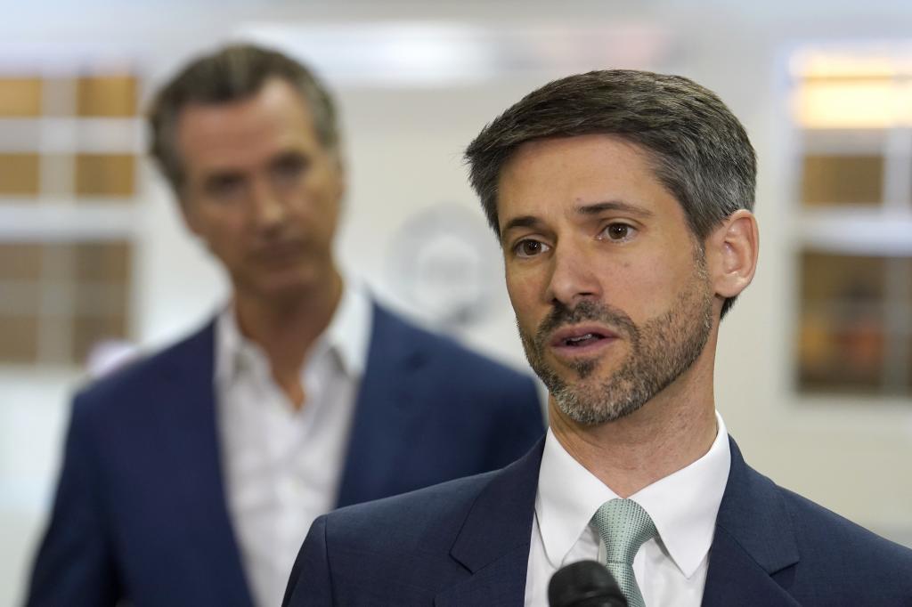 San Jose Mayor Matt Mahan, right, discusses California Gov. Gavin Newsom's
