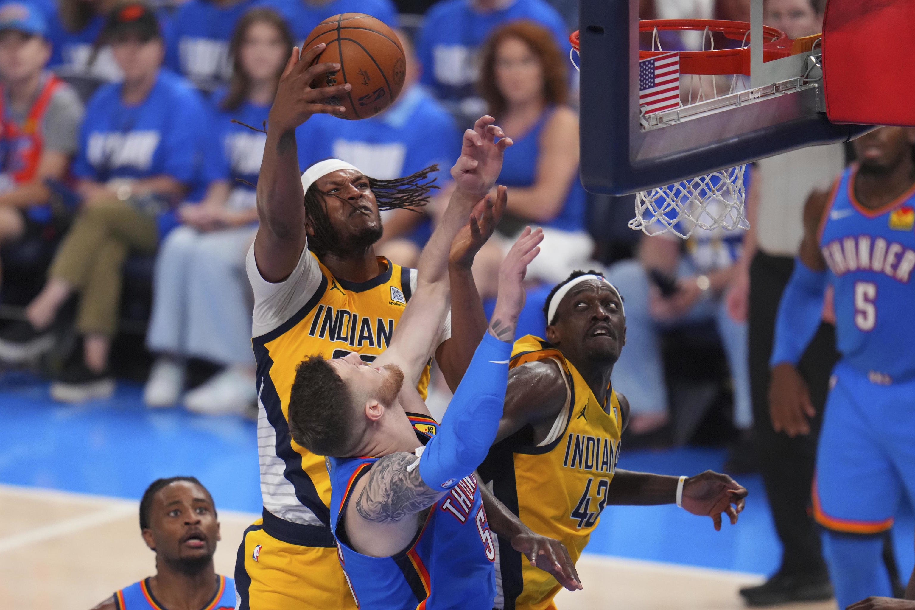 Indiana Pacers center Myles Turner attempts to grab a rebound.