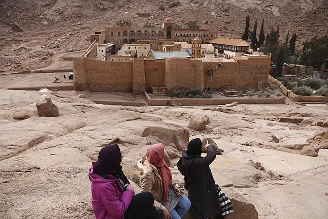 Tourists admire the monastery of Saint Catherine.