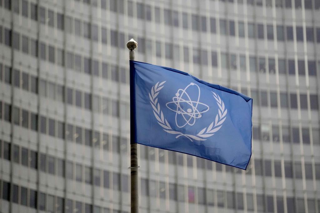 The flag of the International Atomic Energy Agency flies in front of its headquarters during an IAEA Board of Governors