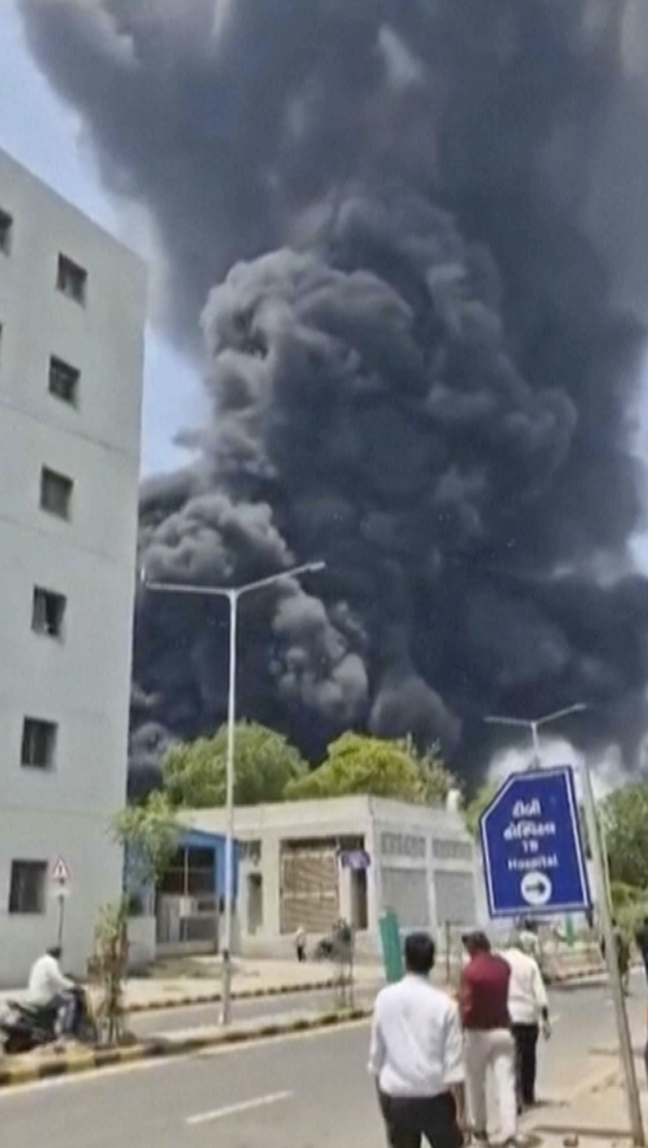 Smoke rises after an airplane crashed in Ahmedabad, Gujarat state, India.