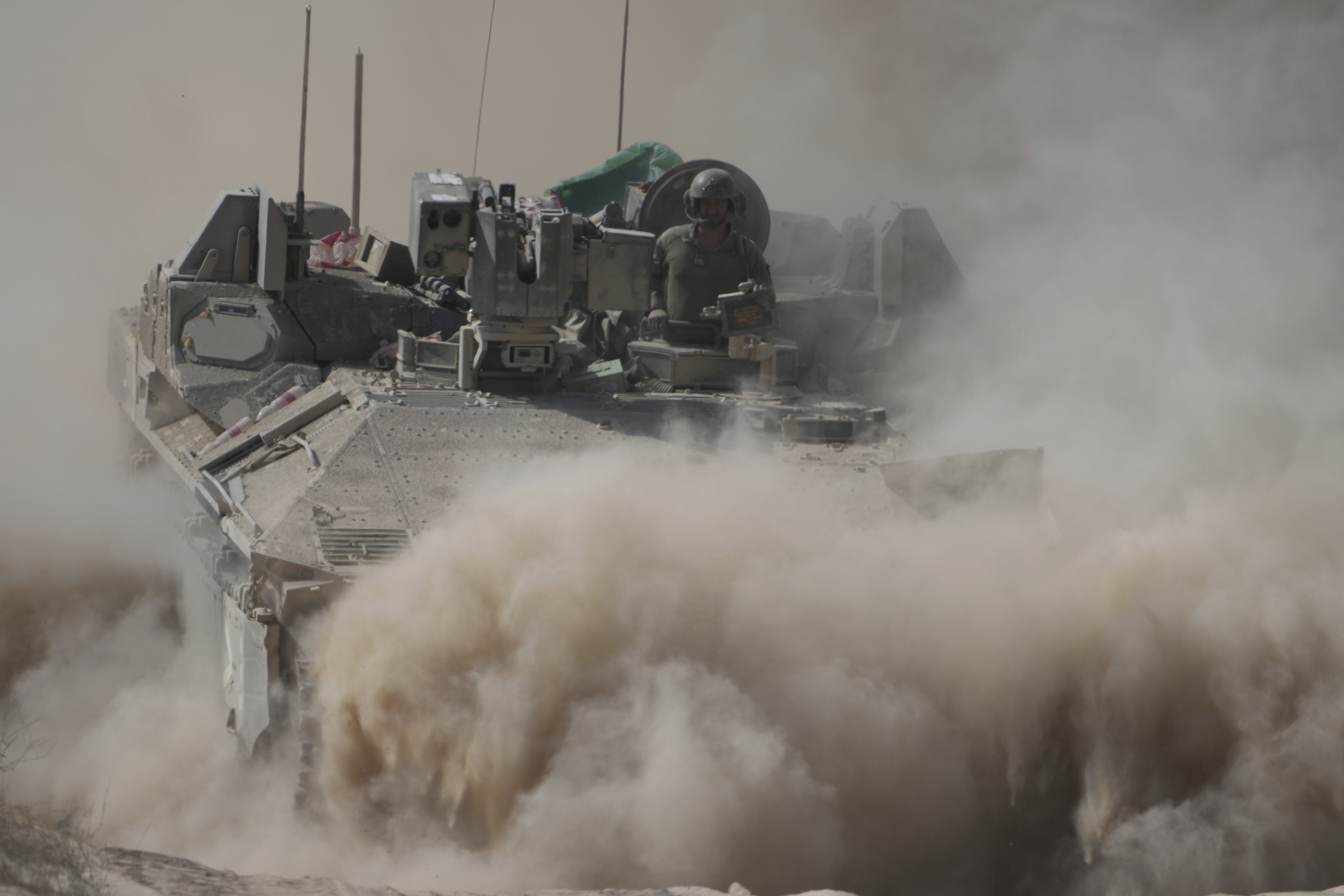 An Israeli army armored personnel carrier maneuvers near the Israel-Gaza border.