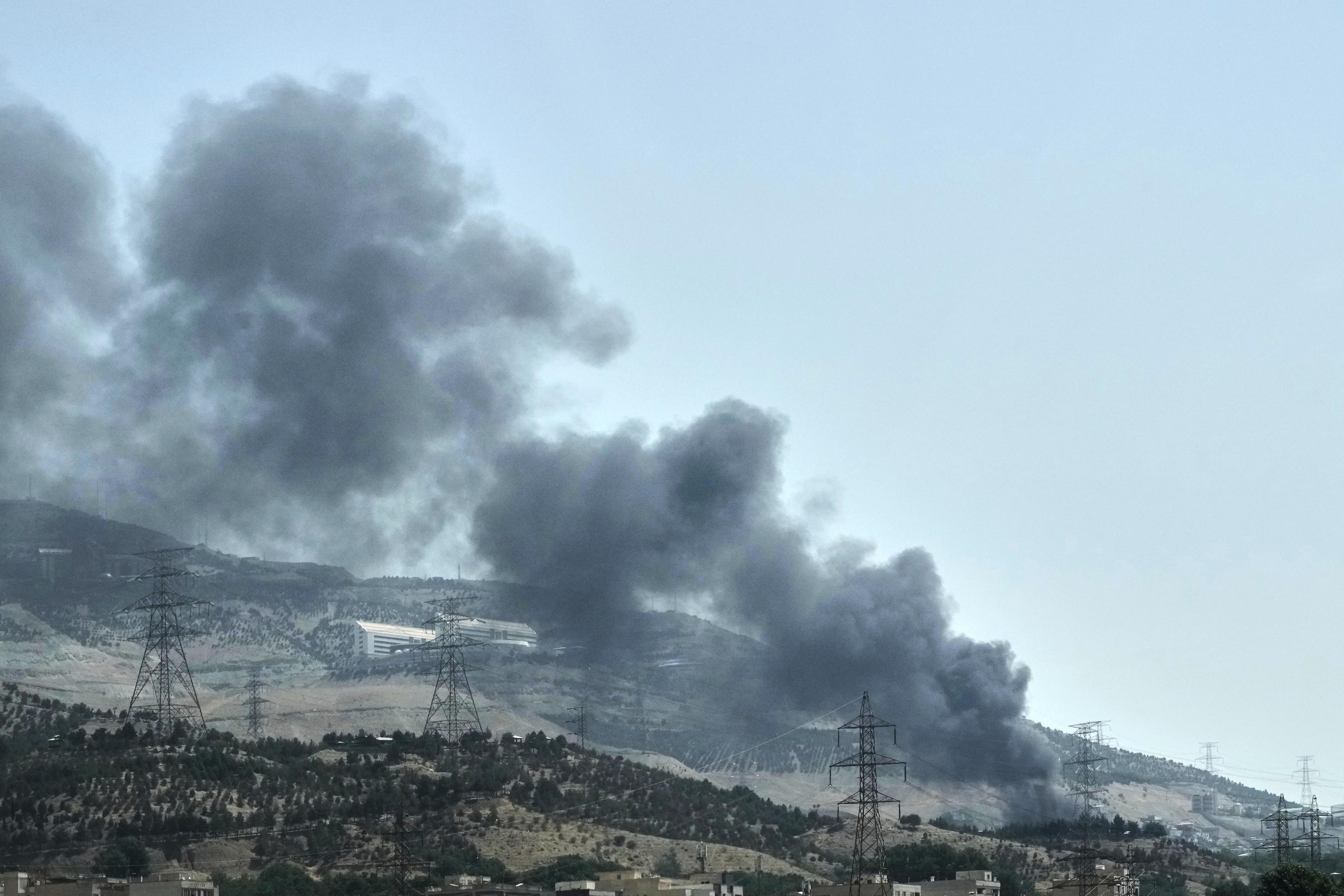 Smoke rises from an oil storage facility in Tehran.