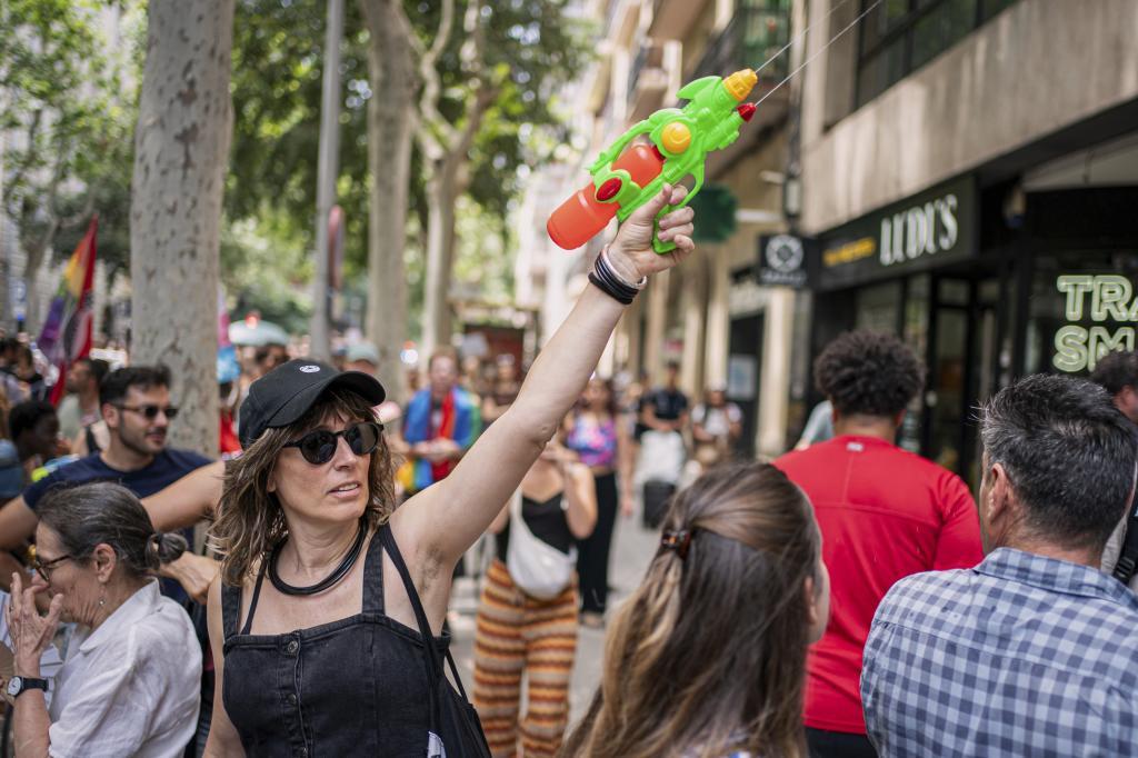 A protester with a water gun participates in a protest against excessive tourism in Barcelona.