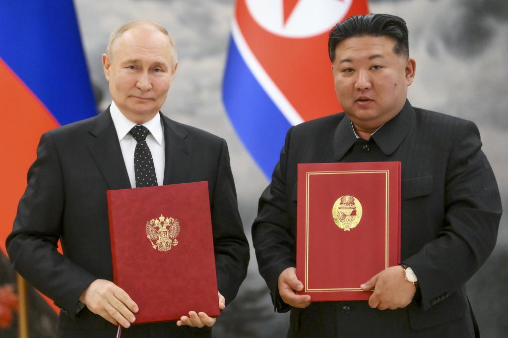 Russian President Vladimir Putin, left, and North Korea's leader Kim Jong