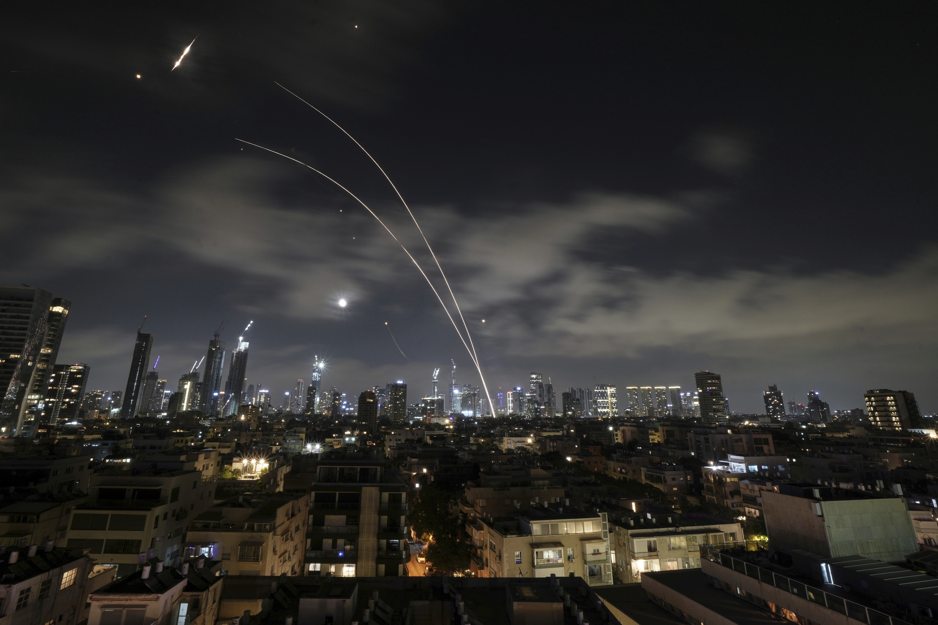 Israeli air defense system fires to intercept missiles during an Iranian attack over Tel Aviv, Israel.