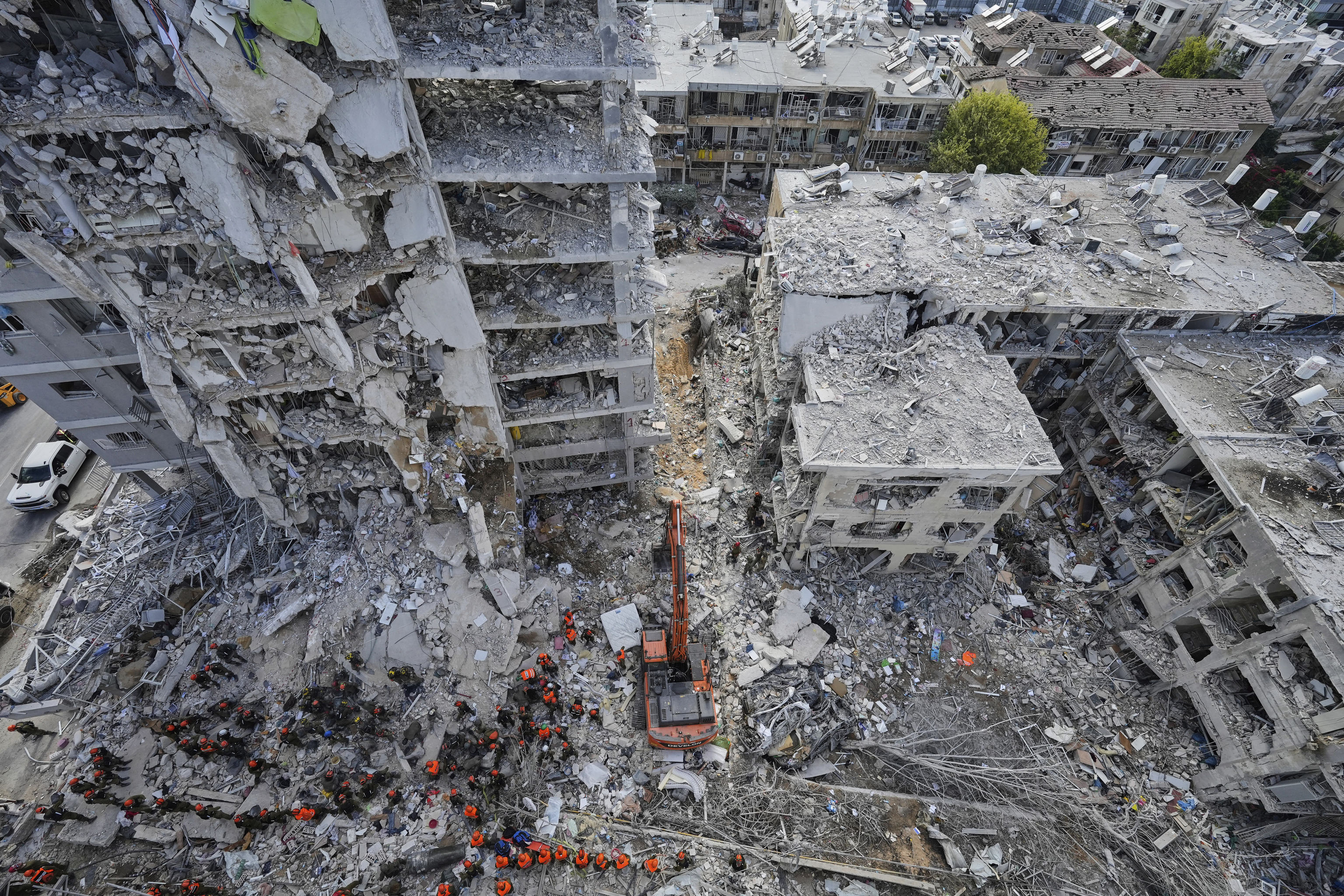 Israeli soldiers search through the rubble of residential buildings destroyed by an Iranian missile strike in Bat Yam.
