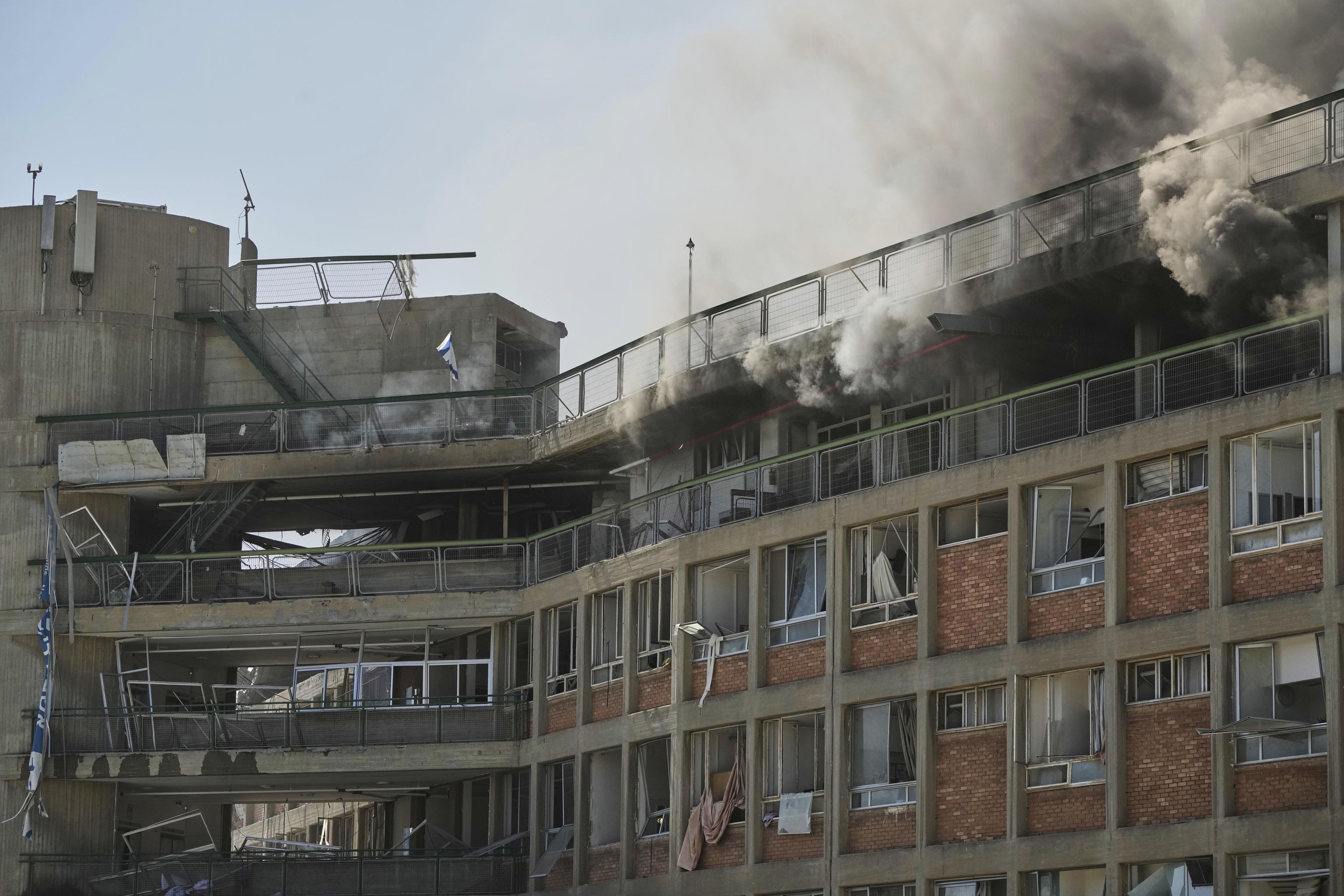 Smokes rises from a building of the Soroka hospital complex in Israel.