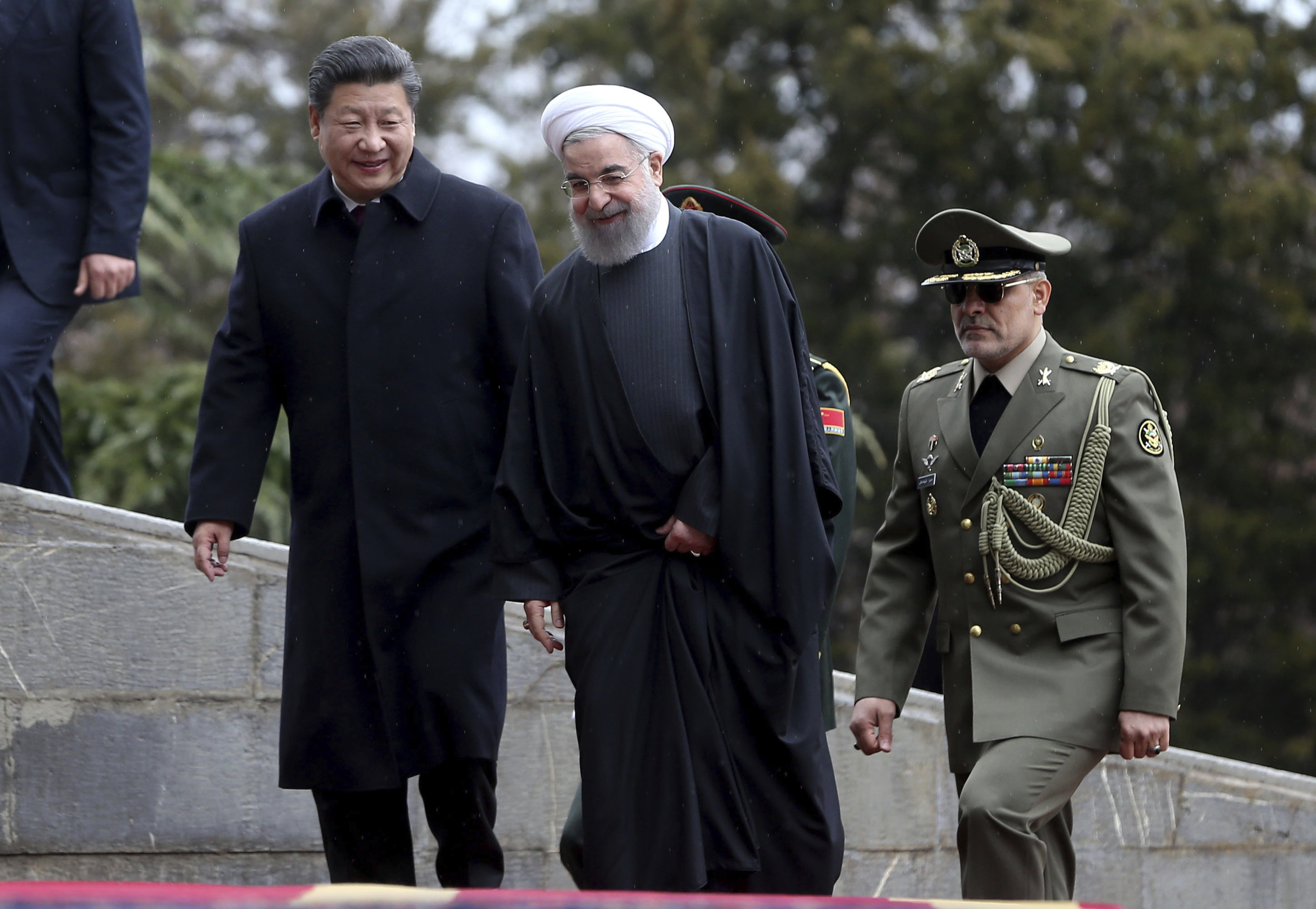Chinese President Xi Jinping, left, is welcomed by Iranian President Hassan Rouhani.