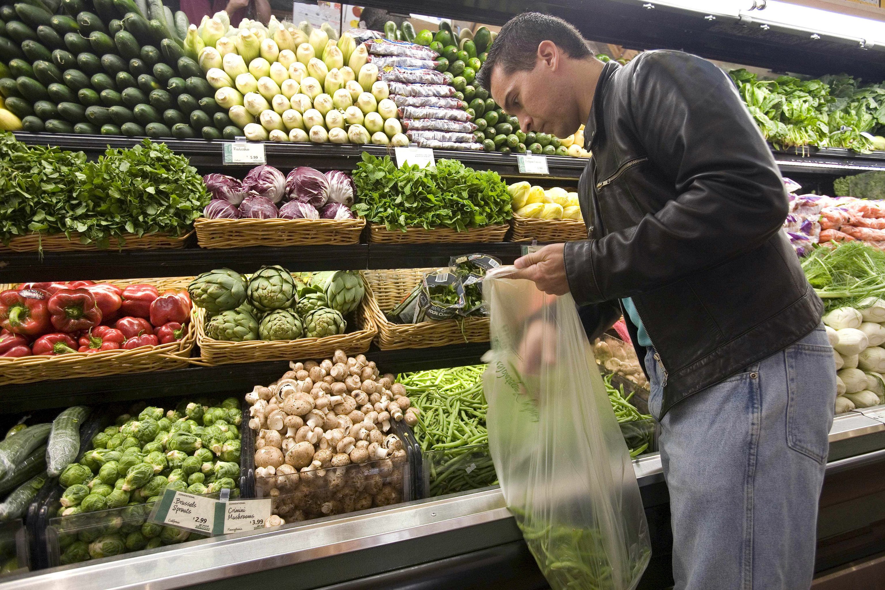 A person buying fruit at the supermarket.