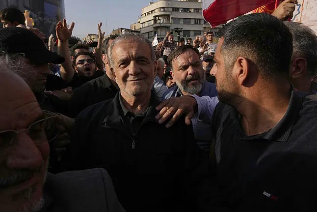 Iranian President, Pezeshkian, attends a protest following the American attacks.