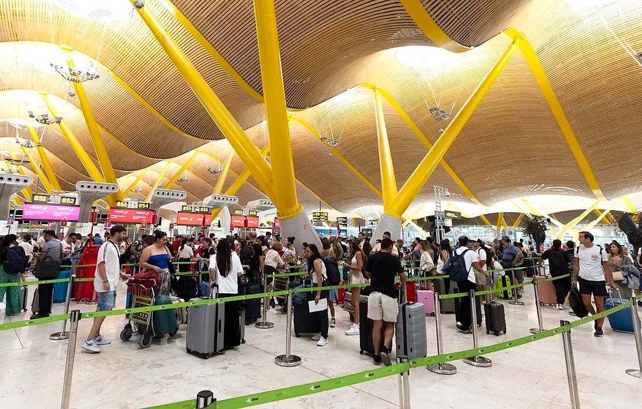 Passengers in the check-in line at Madrid's Barajas airport.