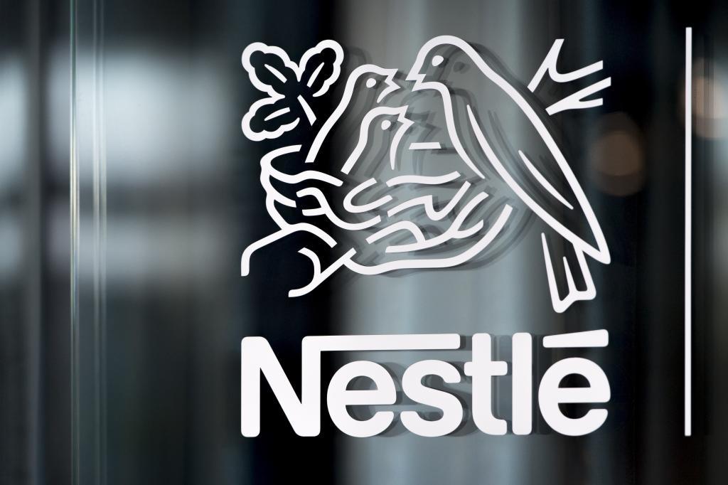 Nestle's logo is displayed on a window in Vevey