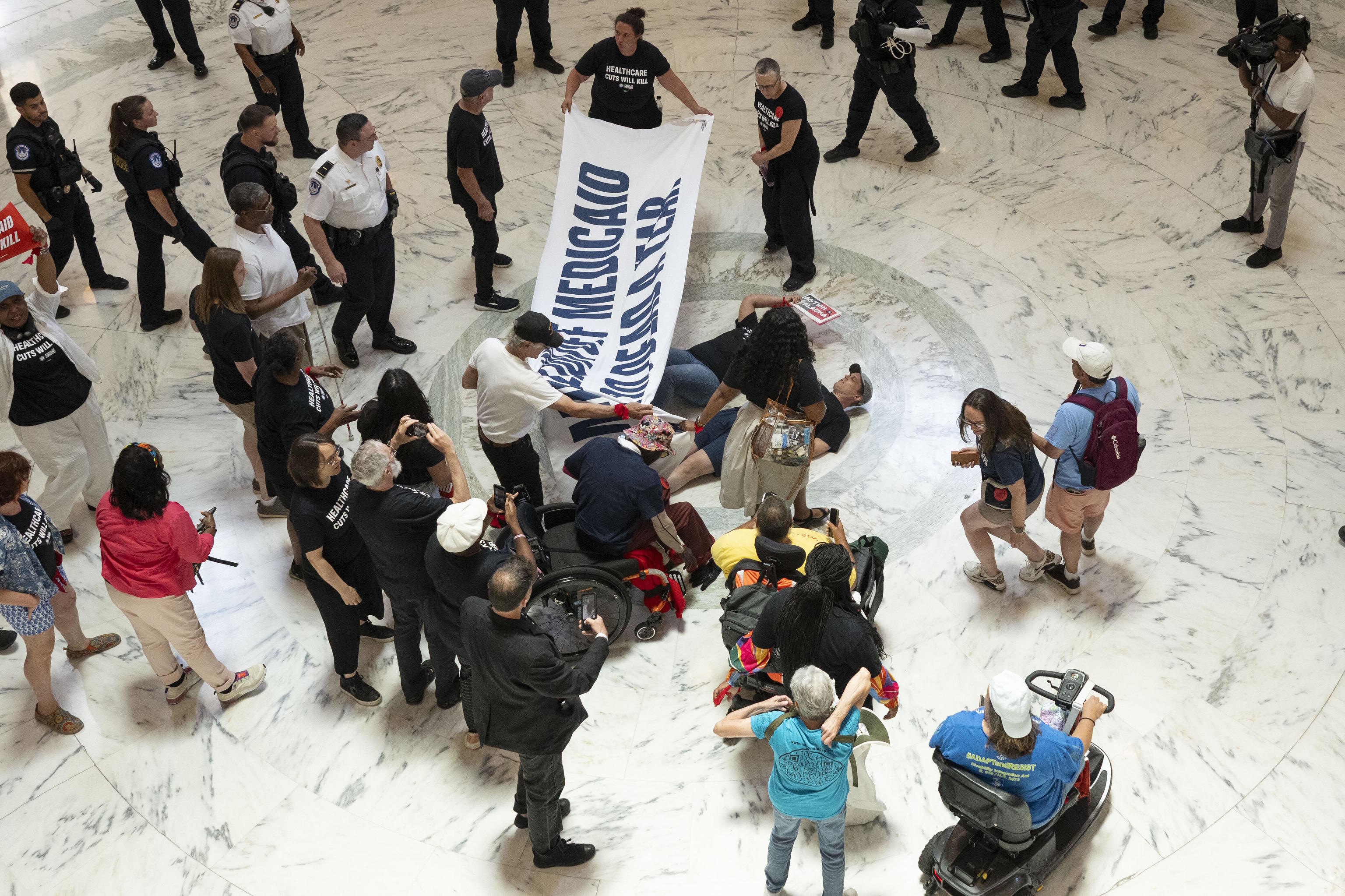 Medicaid and SNAP recipients protest proposed cuts to social safety net programs.