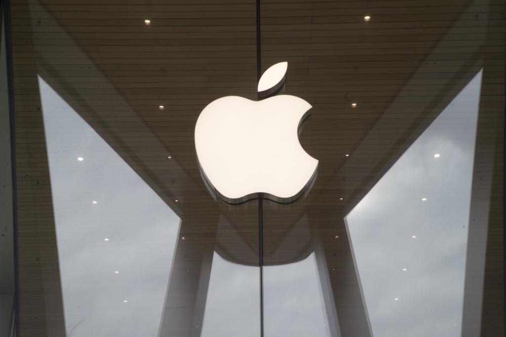The Apple logo is displayed at an Apple store.