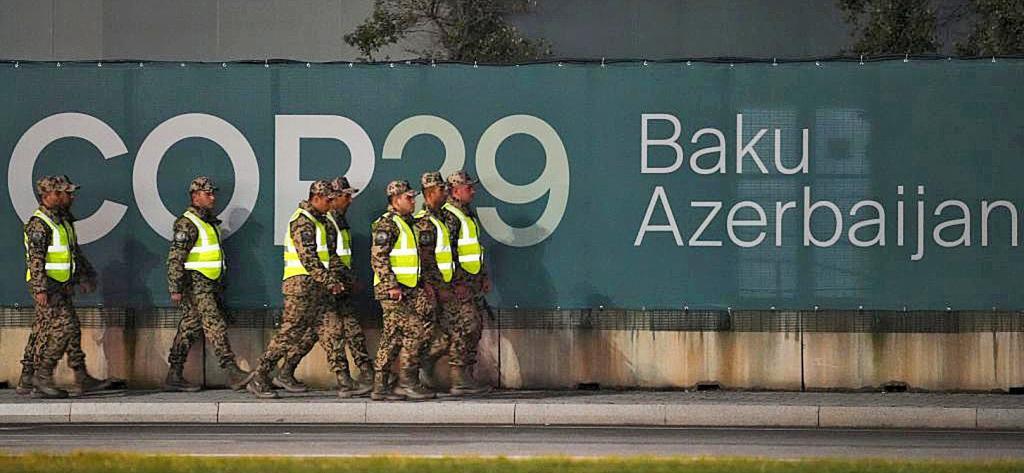 Security personnel walk outside the venue for the COP29 U.N. Climate Summit