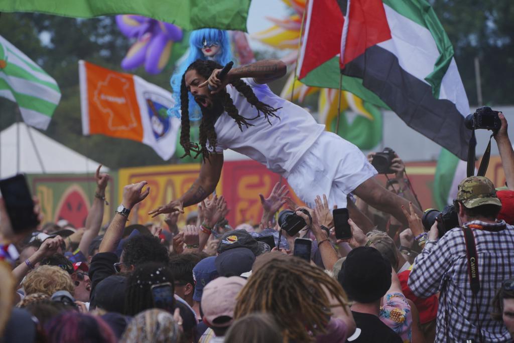 Bob Vylan jumps into the audience during a performance on the West Holts Stage during the Glastonbury Festival
