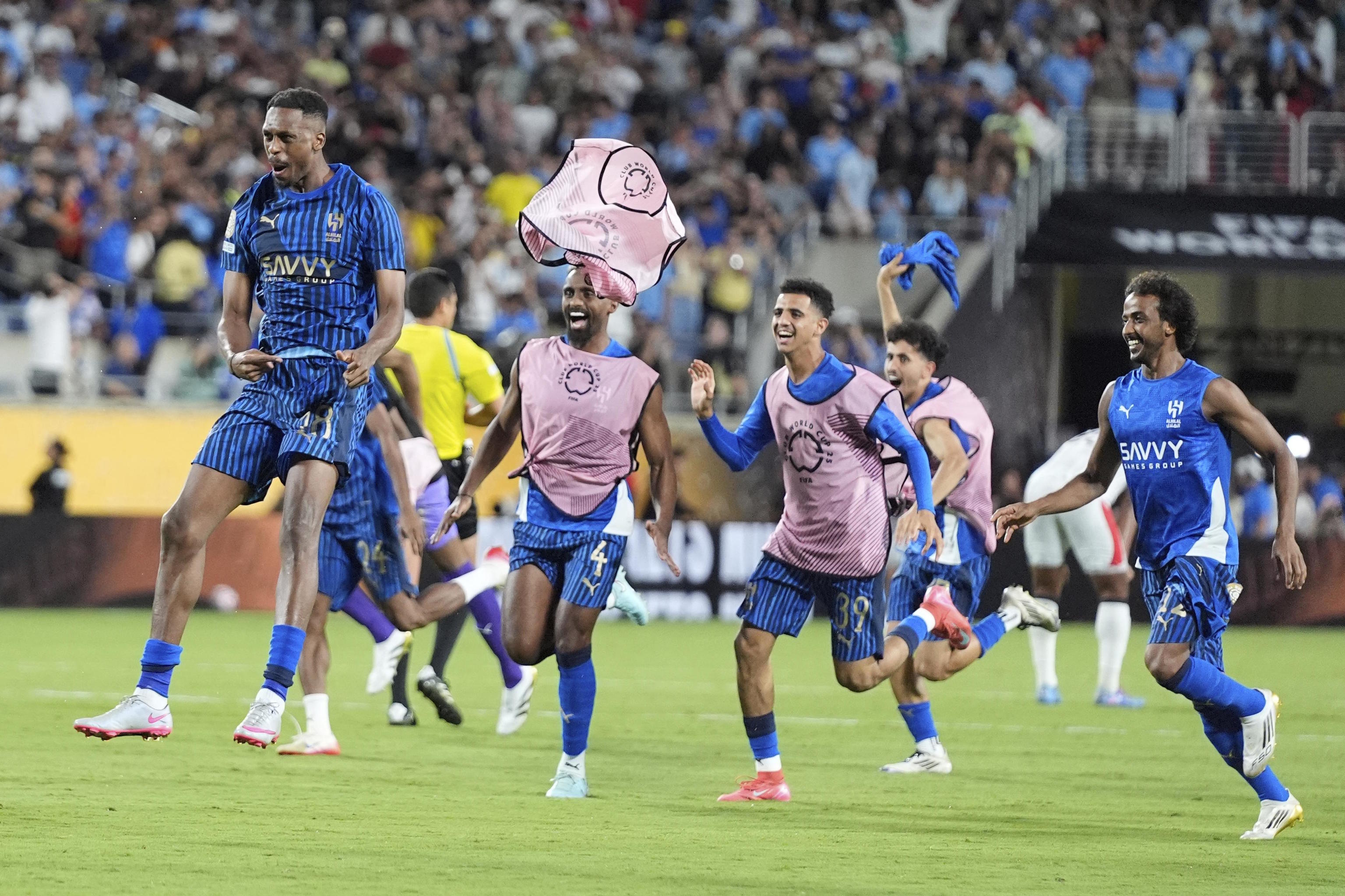 Al Hilal players celebrate the victory.