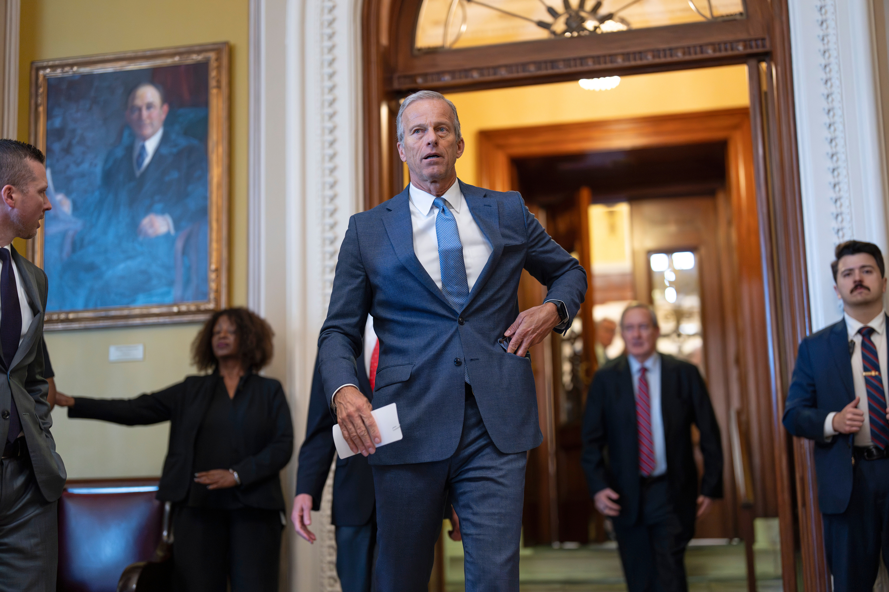 Senate Majority Leader John Thune, R-S.D., emerges from the chamber.