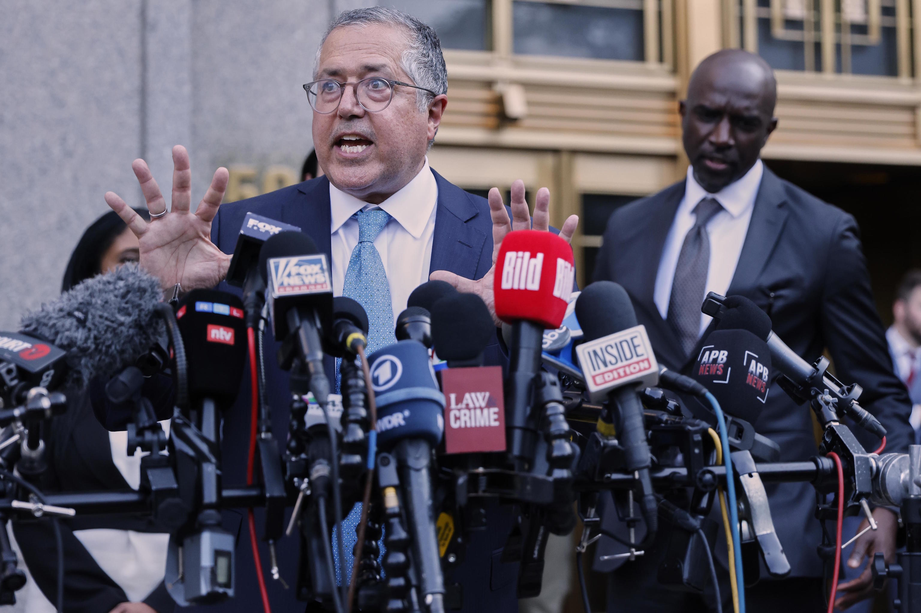 Defense attorney Marc Agnifilo speaks outside Manhattan federal court.