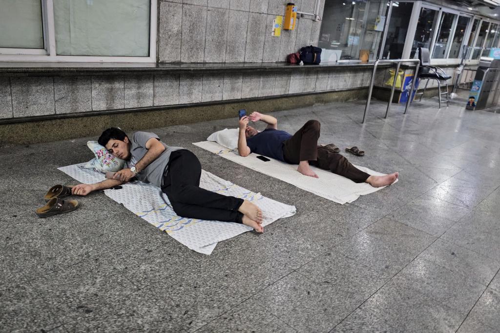 After an emergency evacuation alert, residents seek shelter in a metro station in Tehran, Iran