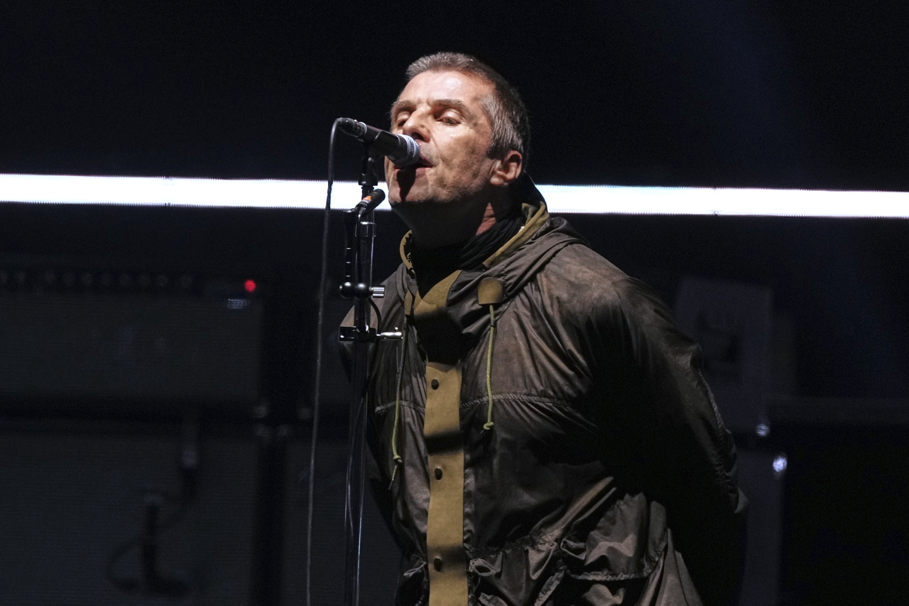Liam Gallagher from the band Oasis performs during their reunion concert.