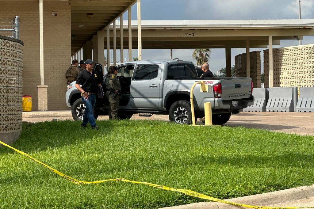 Officials work the scene of a shooting at a Border Patrol facility in McAllen