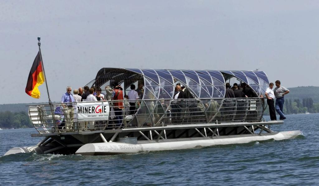 Passengers aboard Helio, the first solar train, which crosses Lake Constance linking the cities of Gaienhofen (Germany) and Steckborn (Switzerland).